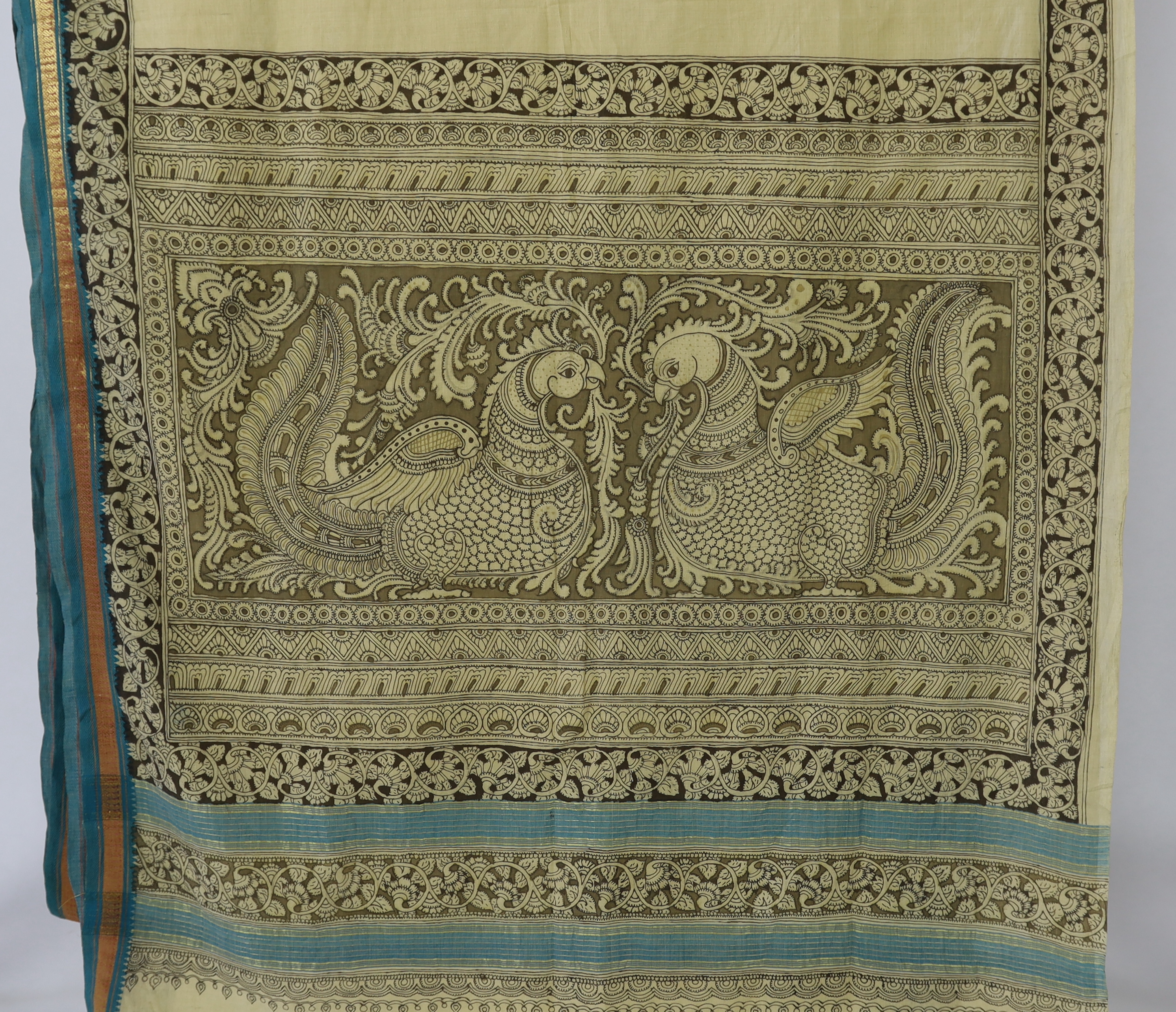 An Indian, Srikalahasti (north of Madras), 'Kalamkari' (penwork) sari, worked and designed by Krishna Reddy. This penwork design, chiefly used for huge temple hangings, is free drawn, with the fabric spread in the sun to